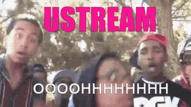 a group of people standing in front of a sign that says " ustream "