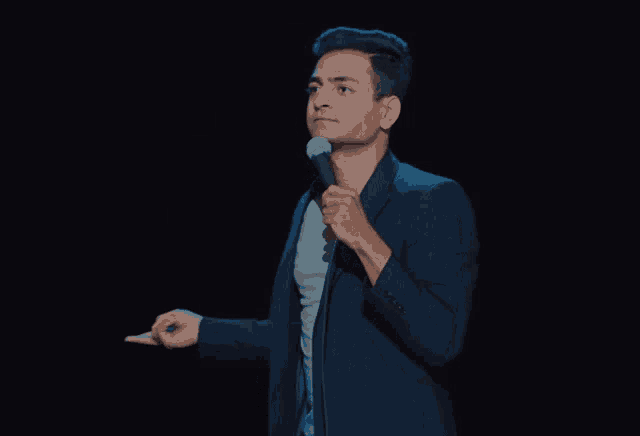 a man is holding a microphone and the word come is on the bottom