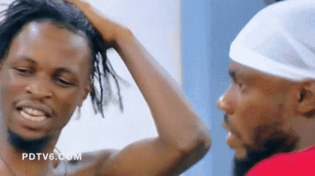 two men are looking at each other and the website pdtv6.com is visible