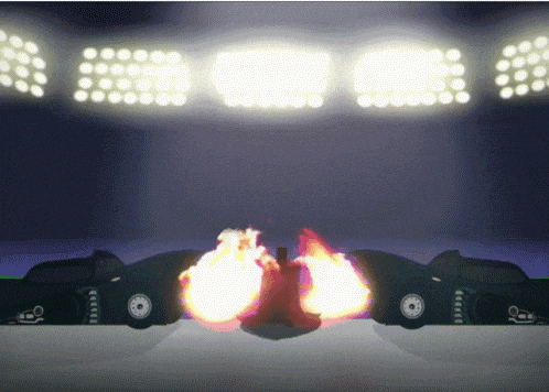 two cars with flames coming out of their tires are in a stadium