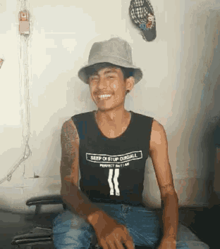 a man wearing a hat and a shirt that says " beep or stop ourfall "