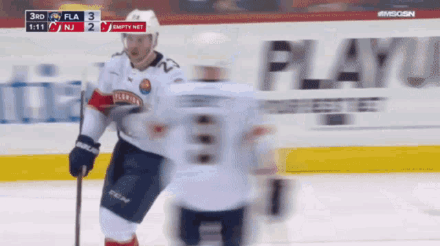 a blurred image of a hockey game between the florida panthers and the new jersey islanders