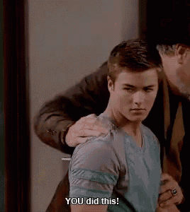 a man is putting his hand on a young man 's shoulder and saying `` you did this '' .