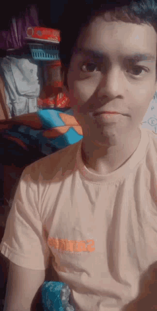a young man taking a selfie wearing a t-shirt that says monkey 2