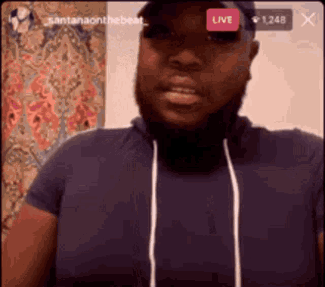 a man with a beard and a hat is live on a facebook page