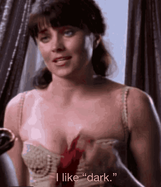 a woman with blood on her chest says " i like " dark "