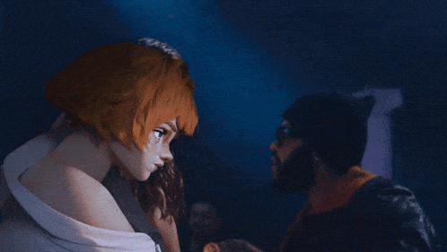 a man with a beard and a woman with red hair looking at each other
