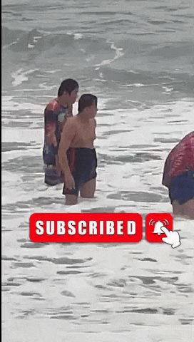 a group of people standing in the water with a subscribed button in the corner