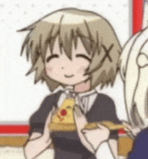a girl is holding a slice of pizza in her hands .