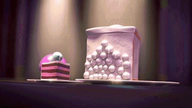 a purple cake and a white cake with bubbles on it