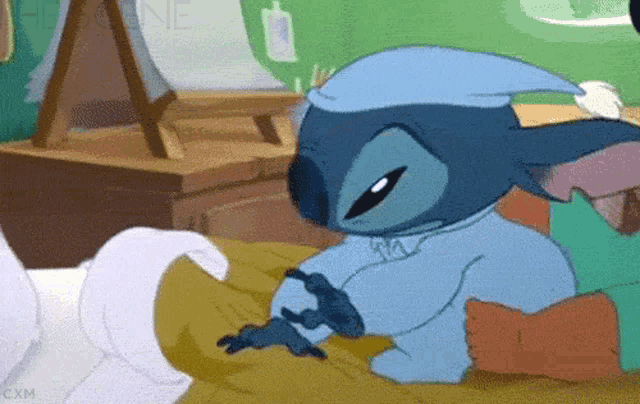 a cartoon of stitch wearing a sleep cap