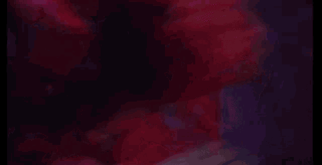 a woman with red hair is laying down with her eyes closed