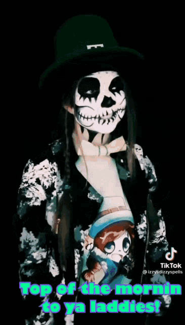 a person with a skeleton face painted on their face and the words top of the morning to ya laddies on the bottom