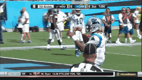 a football game is being shown on a tv screen