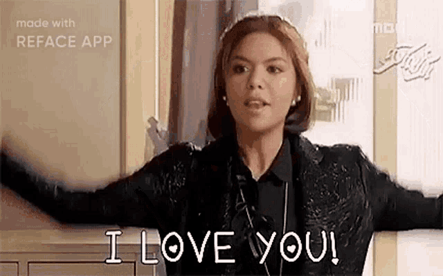 a woman is standing in front of a door with her arms outstretched and says `` i love you '' .