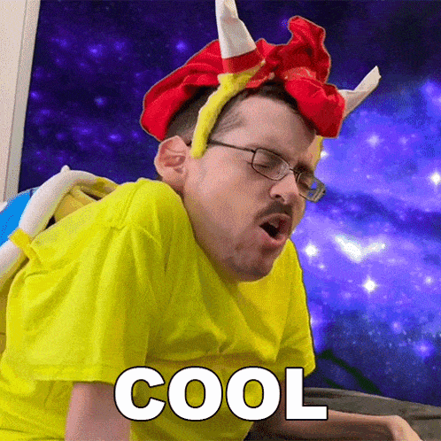 a man wearing a yellow shirt and a red and yellow headband with horns says cool