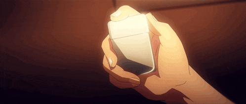 a person is holding a lighter in their right hand