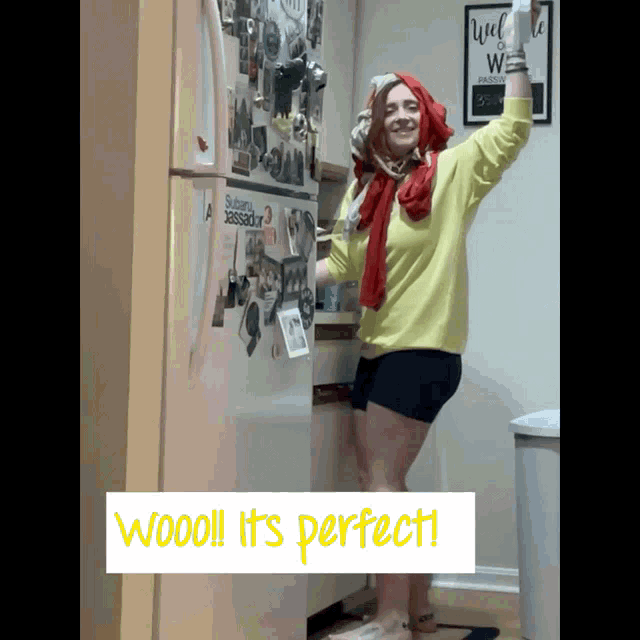 a woman standing in front of a refrigerator with the words wooo it 's perfect written below her