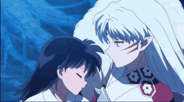 a man and a woman are kissing in a anime .