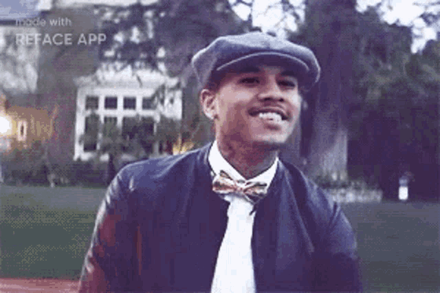 a man wearing a hat and bow tie is smiling while standing in front of a house .
