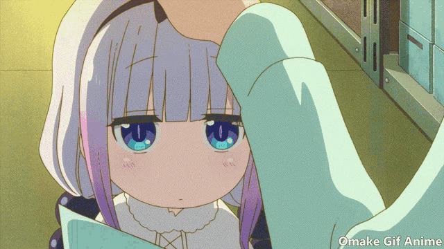 a girl with purple hair and blue eyes is being touched by a person 's hand and the words omake gif anime are below her