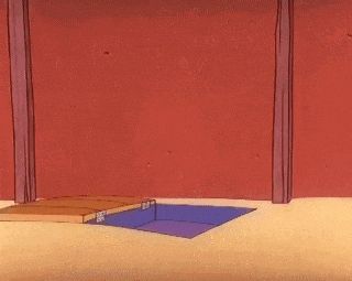 a cartoon drawing of an e on a wooden box