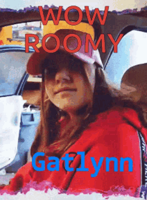 a girl in a red hoodie is sitting in a car with the words wow roomy galynn
