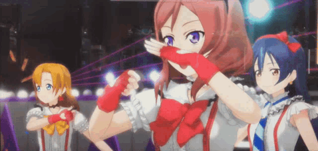 a group of anime girls are dancing on stage
