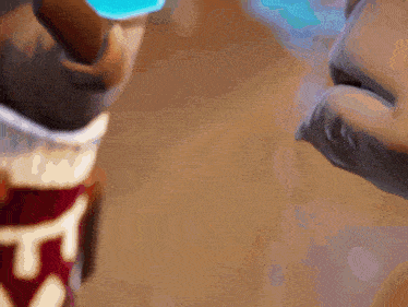 a close up of a person 's face with the letter t visible