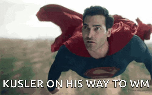 a man in a superman costume is flying through the air with the words kusler on his way to wm written below him