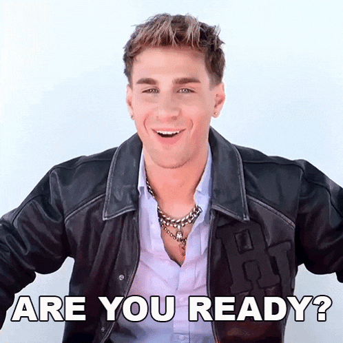 a young man wearing a leather jacket is smiling with the words " are you ready " above him