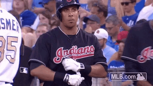 a baseball player for the indians is getting ready to hit the ball