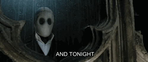 a man in a suit says i 'm going to kill a man in front of a mirror