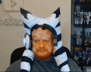 a man is wearing a zebra hat and headphones .