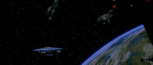 a space ship is flying over the earth with a light coming out of it