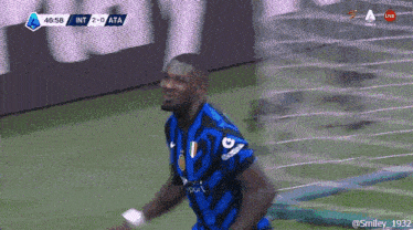 a soccer player is celebrating a goal during a game