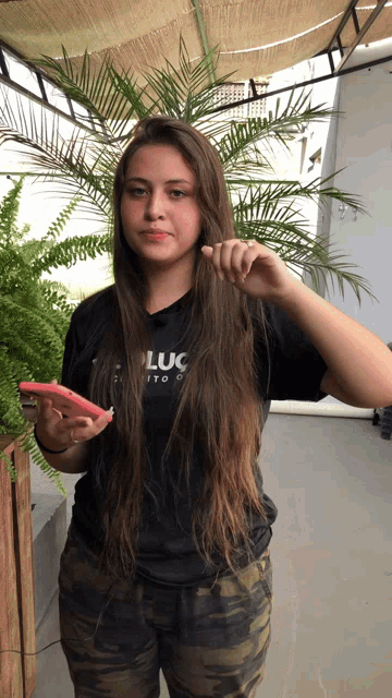 a girl in a black shirt that says luc on it