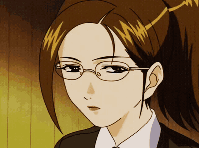 a close up of a woman wearing glasses and ponytail