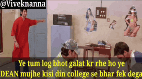 a man in a red shirt is pointing at another man in a room with the words ye tum log bhot galat kr rhe ho ye
