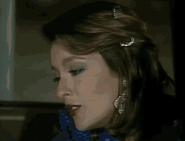 a close up of a woman 's face smiling