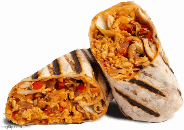 a burrito is cut in half on a white surface
