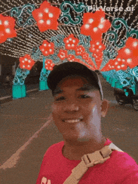 a man in a pink shirt is smiling in front of a sign that says pixverse.ai