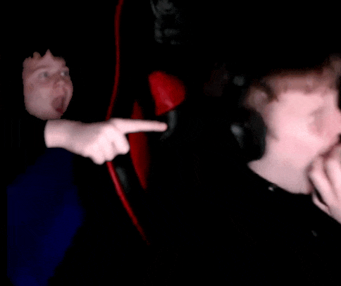 a blurry picture of a person 's face and a hand pointing