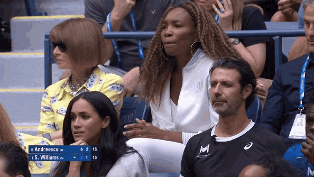 a tennis match between andreescu and williams is being played