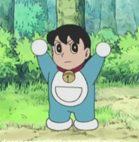 a baby doraemon is standing in the grass with his arms outstretched .