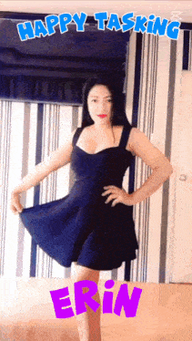 a woman in a black dress is standing in front of a wall with the words happy tasking erin written on it