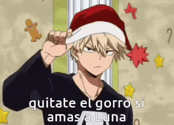 a man wearing a santa hat with the words `` quitate el gorro si ama a luna '' written on it .