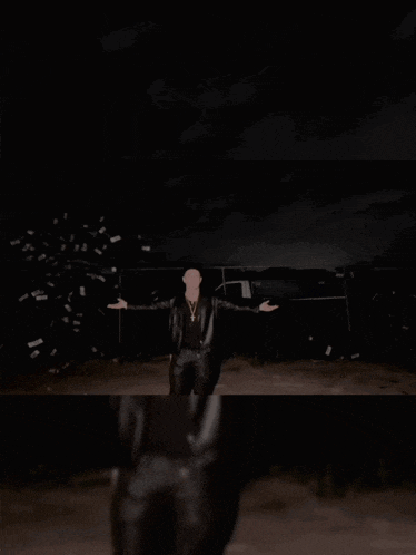a man in a leather jacket holds a piece of paper that says lil bitch on it