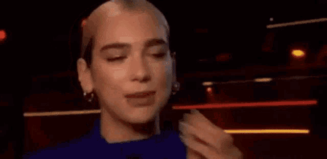 a woman is holding her mouth open and saying `` lonita i love you '' with a heart .