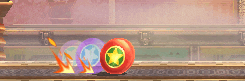 a video game scene with a red ball with a yellow star on it